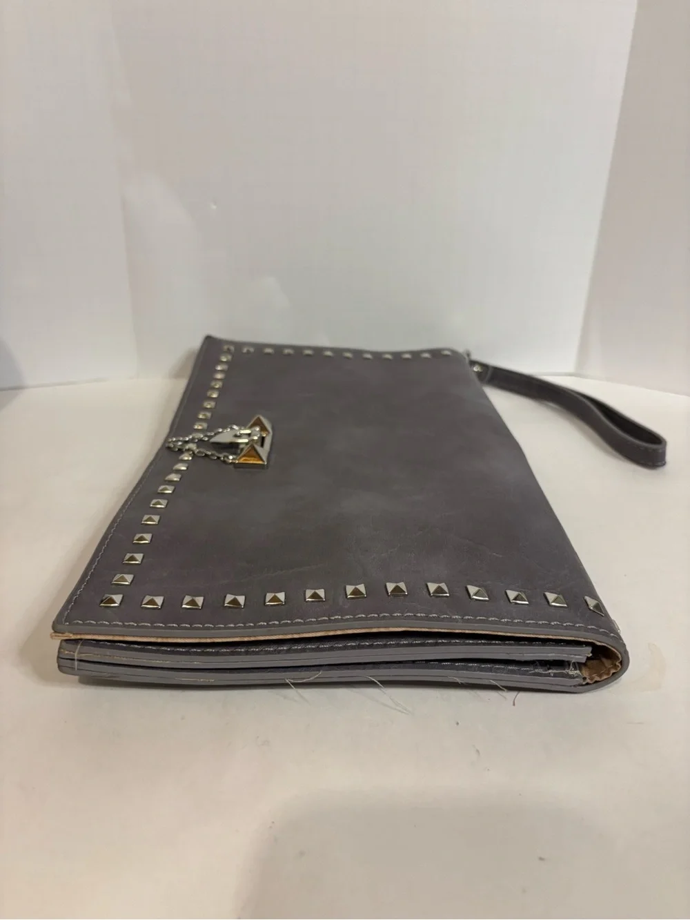Stud-Trim Gray Wristlet Clutch